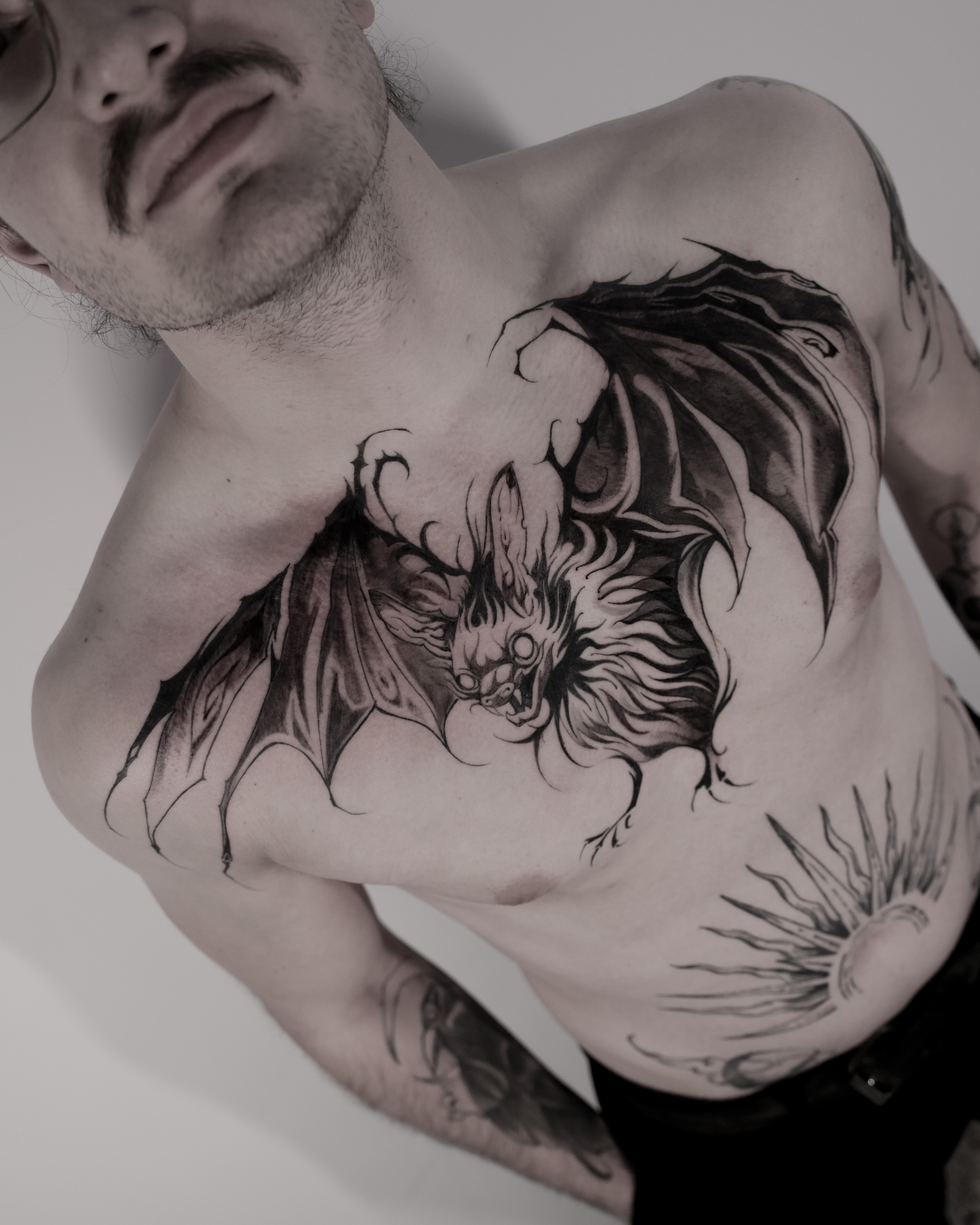 Bat chest tattoo by Juano San